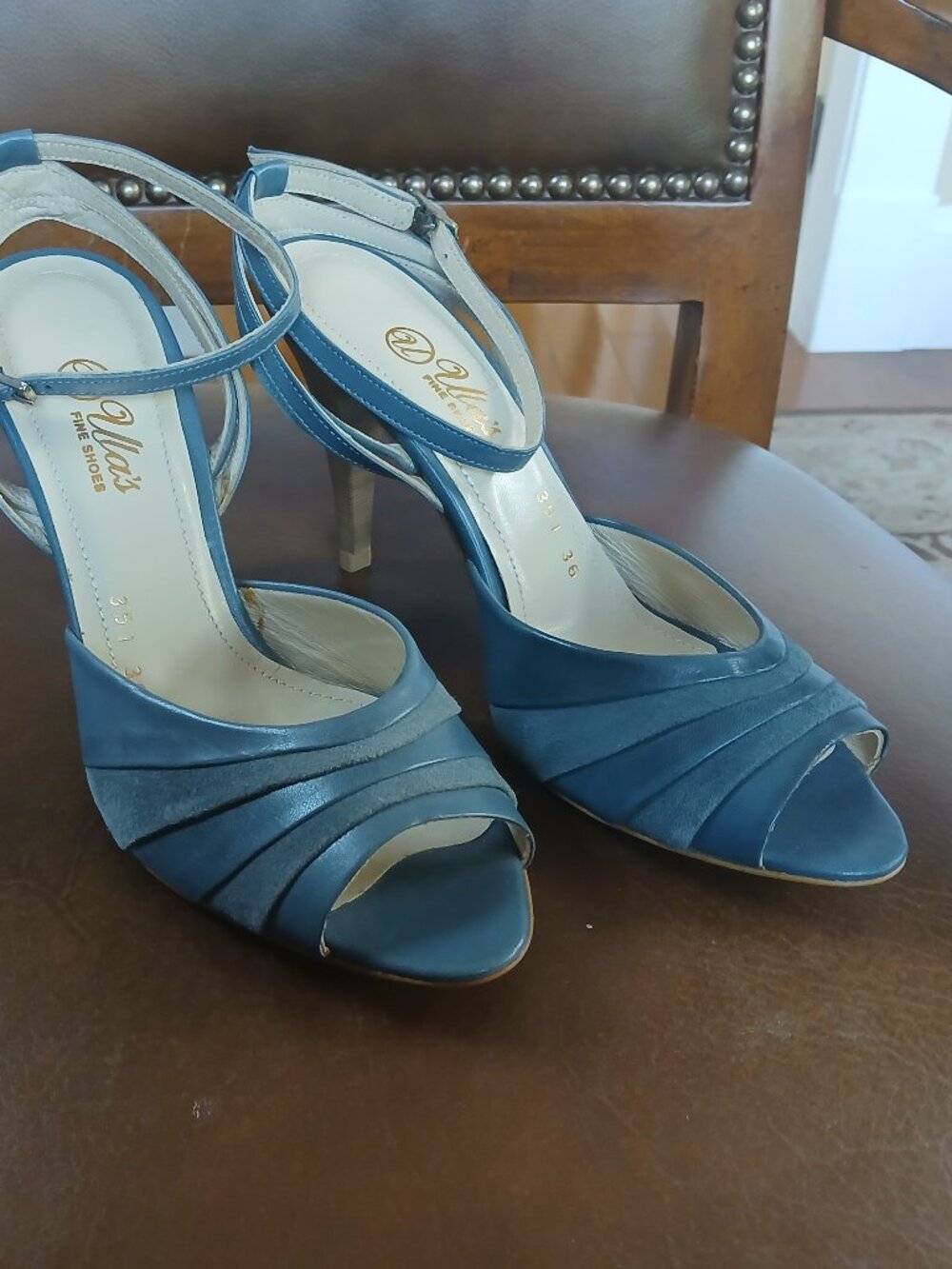 Strapped leather heels in 2 tone mid blue colors.